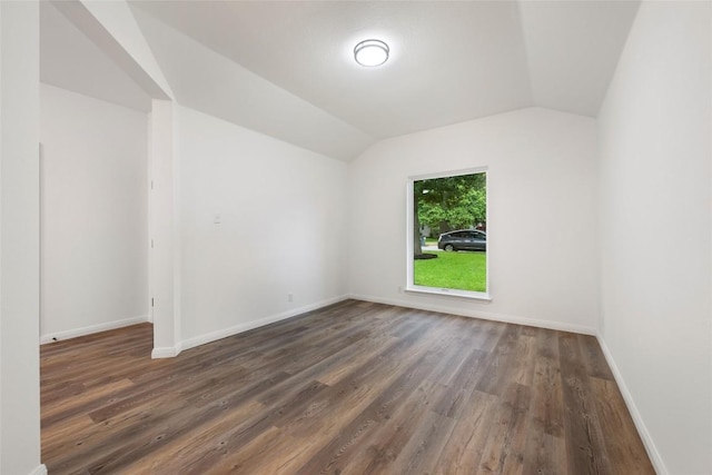 608 Haleys Cv, Leander, TX 78641 - empty room featuring wood finished floors and vaulted ceiling