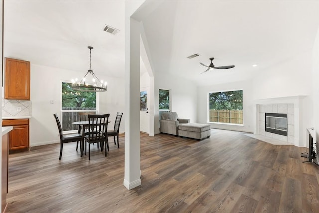 608 Haleys Cv, Leander, TX 78641 - dining room with ceiling fan, healthy amount of natural light, wood finished floors, and a chandelier