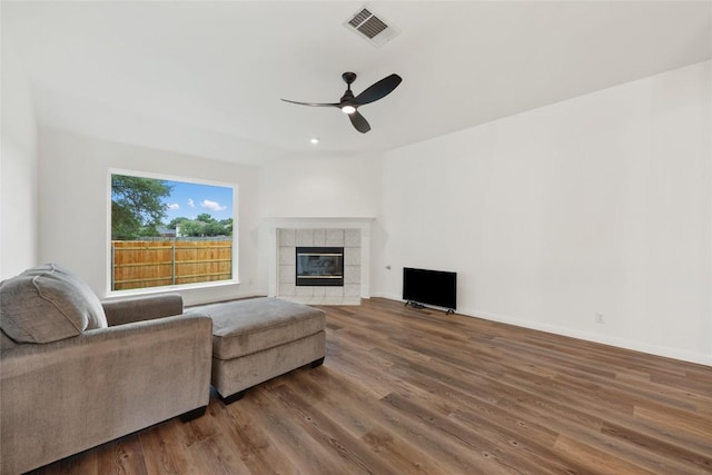 608 Haleys Cv, Leander, TX 78641 - living area with a ceiling fan, wood finished floors, and a fireplace