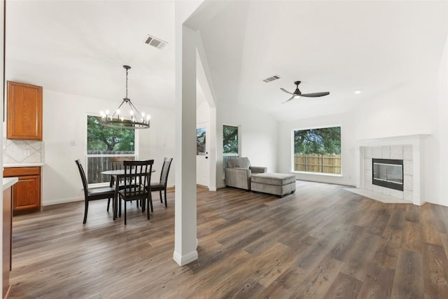 608 Haleys Cv, Leander, TX 78641 - dining space featuring a ceiling fan, healthy amount of natural light, dark wood-type flooring, and a chandelier