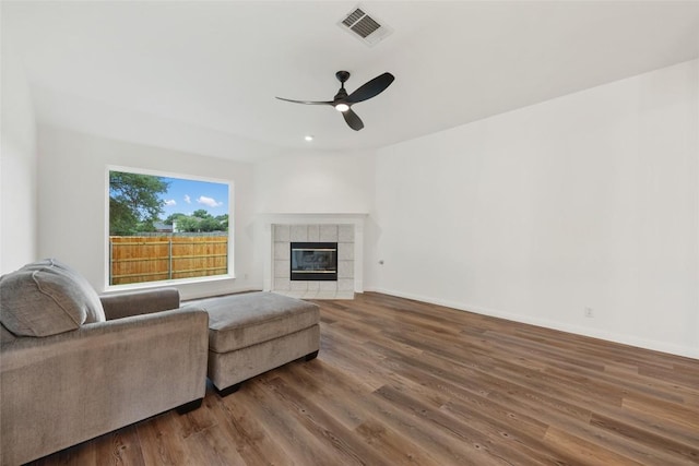 608 Haleys Cv, Leander, TX 78641 - living area featuring ceiling fan, wood finished floors, a fireplace, and recessed lighting