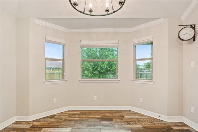 5012 Jeanine Dr, Temple, TX 76502 - empty room with wood finished floors, a chandelier, and crown molding