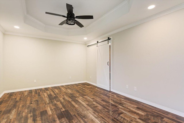 5012 Jeanine Dr, Temple, TX 76502 - unfurnished room featuring dark wood-type flooring, a barn door, a raised ceiling, ceiling fan, and crown molding