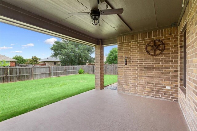 5012 Jeanine Dr, Temple, TX 76502 - fenced backyard with ceiling fan and a patio