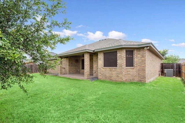 5012 Jeanine Dr, Temple, TX 76502 - rear view of house with a fenced backyard, a patio, and brick siding