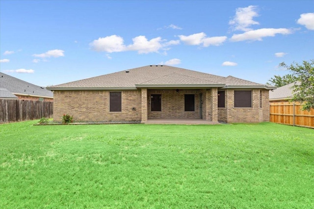 5012 Jeanine Dr, Temple, TX 76502 - back of property featuring a fenced backyard, brick siding, and a patio
