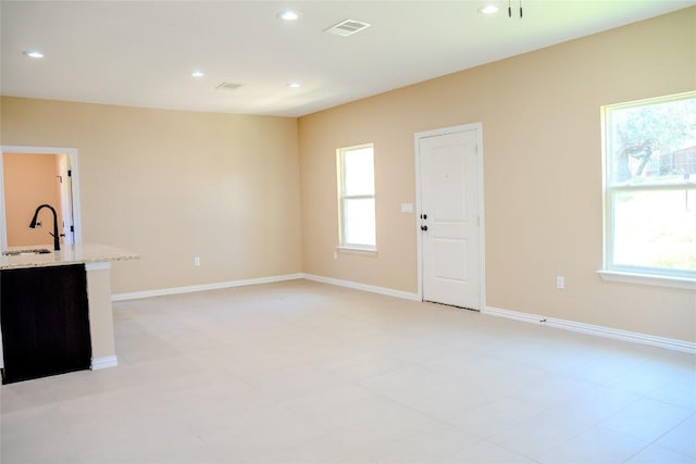 2220 Mc Arthur Ave, Kingsland, TX 78639 - unfurnished living room featuring a sink and recessed lighting