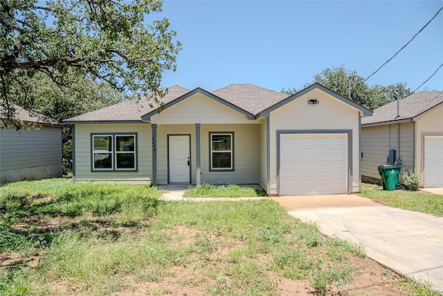 2220 Mc Arthur Ave, Kingsland, TX 78639 - single story home with a garage, driveway, and a shingled roof