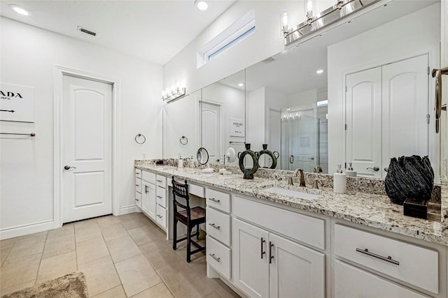 120 Delfino Pl, Horseshoe Bay, TX 78657 - full bathroom with a stall shower, double vanity, tile patterned floors, and recessed lighting