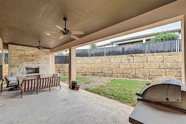 120 Delfino Pl, Horseshoe Bay, TX 78657 - fenced backyard with an outdoor stone fireplace, a patio, and ceiling fan