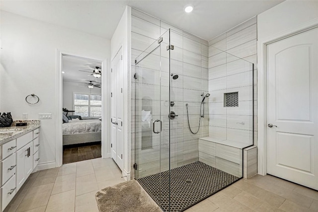 120 Delfino Pl, Horseshoe Bay, TX 78657 - ensuite bathroom with tile patterned flooring, vanity, a shower stall, ceiling fan, and recessed lighting