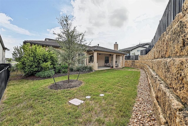 120 Delfino Pl, Horseshoe Bay, TX 78657 - back of house featuring a fenced backyard, a patio area, a ceiling fan, a chimney, and stucco siding