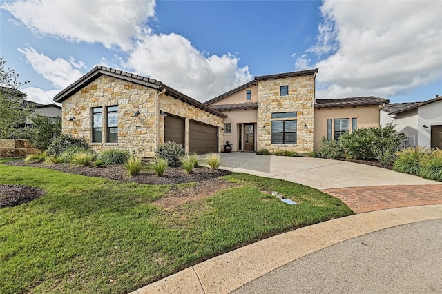 120 Delfino Pl, Horseshoe Bay, TX 78657 - view of front of property featuring stone siding, a garage, driveway, a front yard, and stucco siding