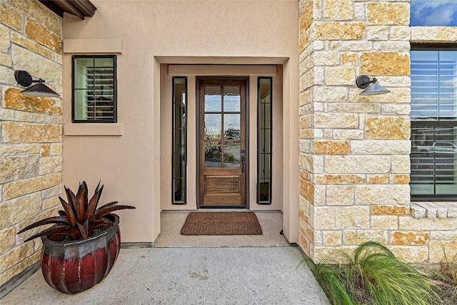 120 Delfino Pl, Horseshoe Bay, TX 78657 - view of exterior entry with stone siding and stucco siding