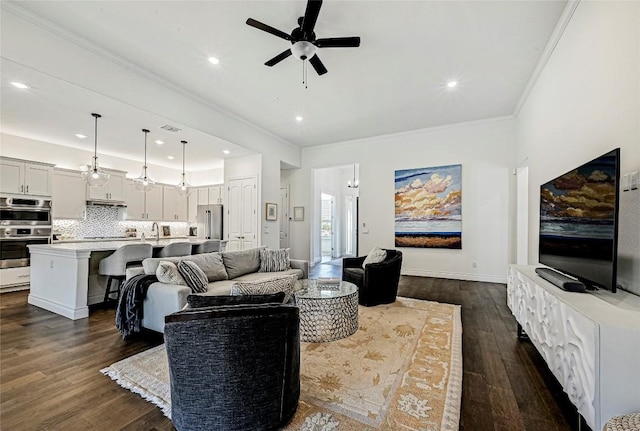 120 Delfino Pl, Horseshoe Bay, TX 78657 - living area featuring a ceiling fan, dark wood finished floors, crown molding, and recessed lighting