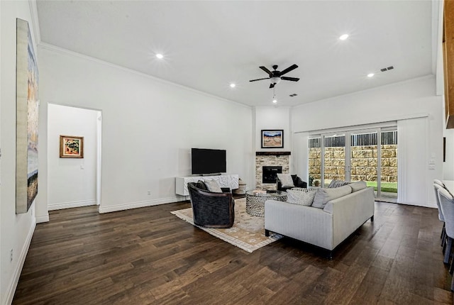 120 Delfino Pl, Horseshoe Bay, TX 78657 - living area featuring a fireplace, ceiling fan, crown molding, dark wood-style flooring, and recessed lighting
