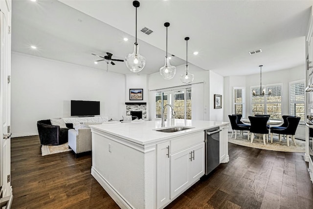 120 Delfino Pl, Horseshoe Bay, TX 78657 - kitchen featuring dishwasher, white cabinets, dark wood-style flooring, a ceiling fan, and hanging light fixtures