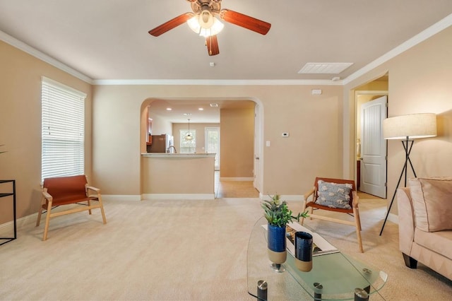 11900 Timber Heights Dr, Austin, TX 78754 - living area featuring arched walkways, a ceiling fan, ornamental molding, and light carpet