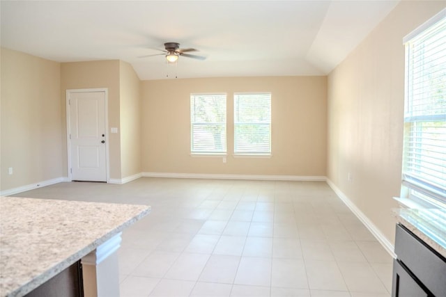 2182 Mcarthur Ave, Kingsland, TX 78639 - unfurnished living room with a ceiling fan, plenty of natural light, and vaulted ceiling
