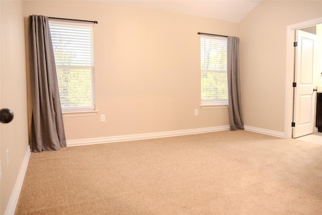 2182 Mcarthur Ave, Kingsland, TX 78639 - spare room featuring carpet flooring and vaulted ceiling