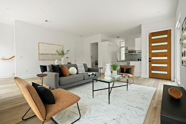 5507 Manor Rd Unit B, Austin, TX 78723 - living room featuring light wood-style floors and stairway