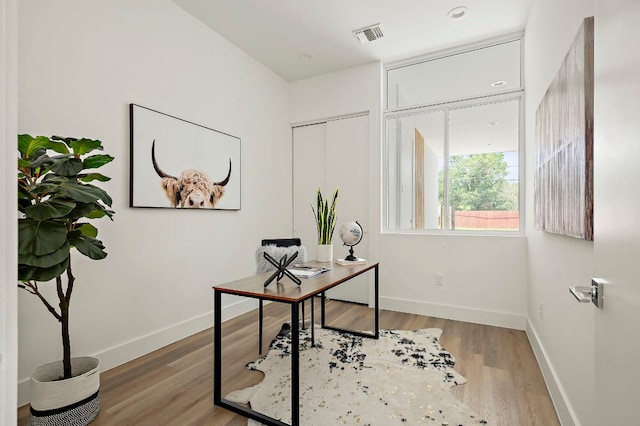 5507 Manor Rd Unit B, Austin, TX 78723 - home office with baseboards and wood finished floors