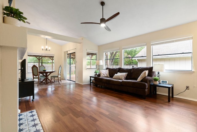 3008 Siskin Dr, Austin, TX 78745 - living room with vaulted ceiling, ceiling fan, wood finished floors, and a chandelier