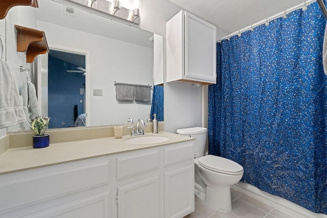 3008 Siskin Dr, Austin, TX 78745 - full bathroom featuring vanity, tile patterned floors, and a shower with shower curtain