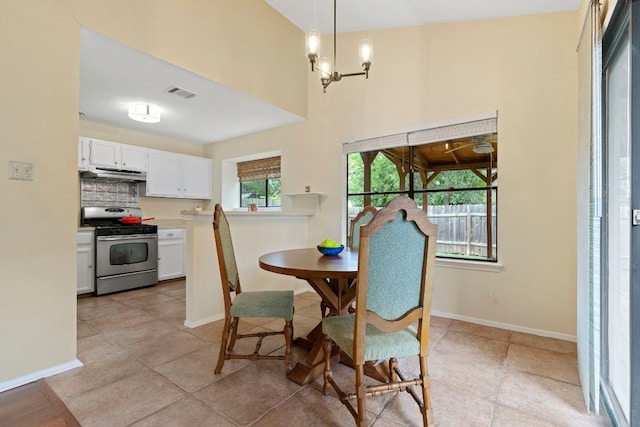 3008 Siskin Dr, Austin, TX 78745 - dining room featuring a chandelier and light tile patterned floors