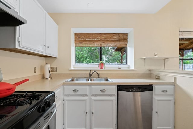 3008 Siskin Dr, Austin, TX 78745 - kitchen featuring dishwasher, under cabinet range hood, white cabinetry, light countertops, and gas stove