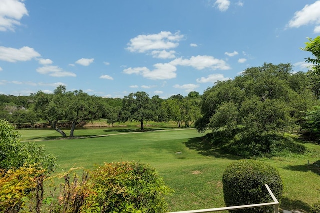 146 Double Eagle Dr, Austin, TX 78738 - view of home's community with a yard, view of wooded area, and golf course view