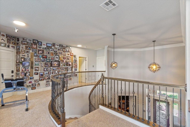 1915 Los Santos Dr, San Marcos, TX 78666 - hallway featuring an upstairs landing, carpet, a textured ceiling, ornamental molding, and recessed lighting