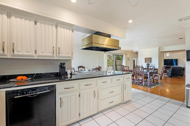 6033 Mount Bonnell Cv, Austin, TX 78731 - kitchen with dishwasher, wall chimney exhaust hood, light tile patterned floors, recessed lighting, and white cabinets