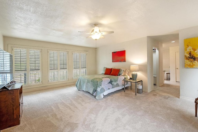 6033 Mount Bonnell Cv, Austin, TX 78731 - carpeted bedroom featuring a textured ceiling and a ceiling fan