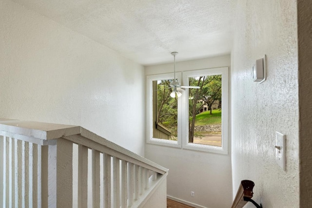 6033 Mount Bonnell Cv, Austin, TX 78731 - stairway with a textured ceiling and a textured wall