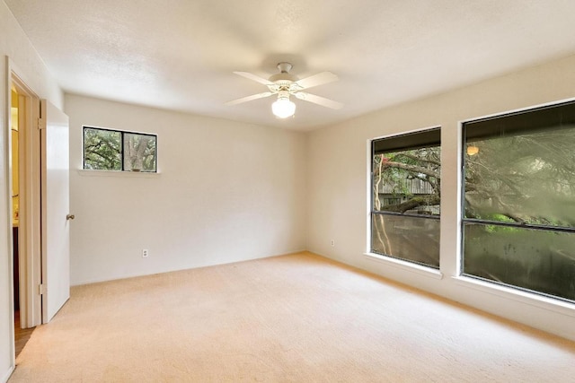 6033 Mount Bonnell Cv, Austin, TX 78731 - empty room with light colored carpet and a ceiling fan