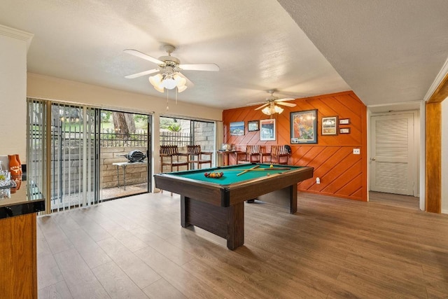 6033 Mount Bonnell Cv, Austin, TX 78731 - playroom with wood finished floors, billiards, a ceiling fan, a textured ceiling, and wooden walls