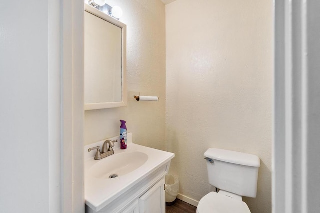 6033 Mount Bonnell Cv, Austin, TX 78731 - half bathroom featuring vanity and toilet
