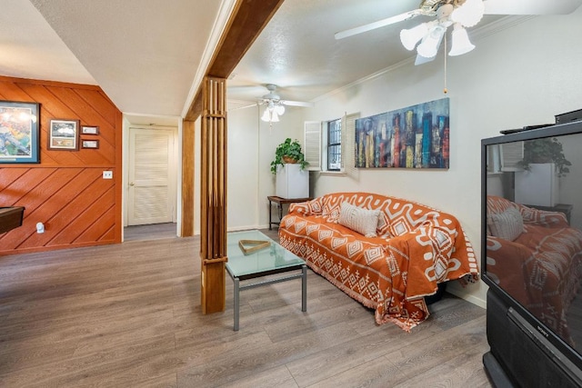 6033 Mount Bonnell Cv, Austin, TX 78731 - living area with ceiling fan, wood finished floors, crown molding, and wood walls