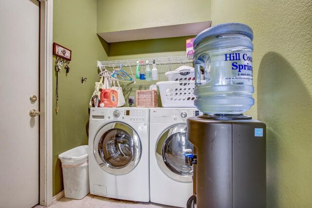 1203 Cardigan St, Cedar Park, TX 78613 - laundry room featuring washer and dryer and tile patterned flooring