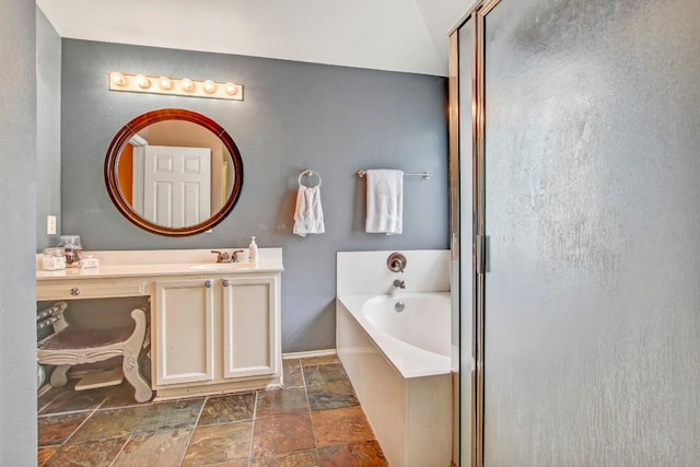 1203 Cardigan St, Cedar Park, TX 78613 - bathroom featuring a garden tub, stone tile floors, vanity, and a shower stall