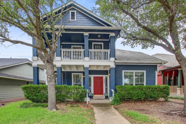 1203 Cardigan St, Cedar Park, TX 78613 - view of front of house with a balcony, a porch, and roof with shingles