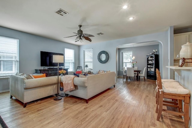 1203 Cardigan St, Cedar Park, TX 78613 - living area featuring arched walkways, light wood-type flooring, ceiling fan, and recessed lighting