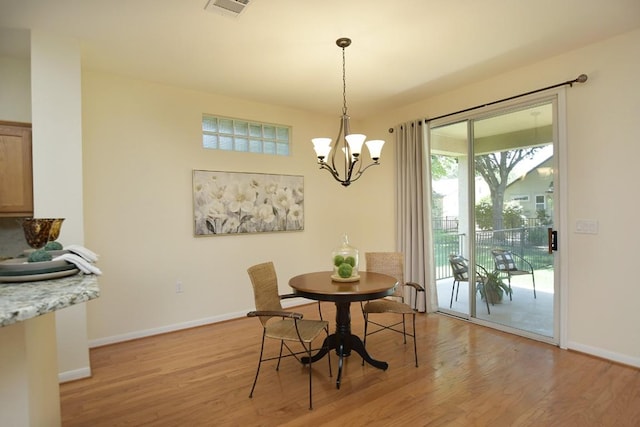 101 Bass St, Georgetown, TX 78633 - dining room with a chandelier and light wood-style flooring