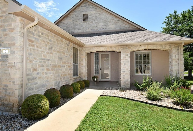 101 Bass St, Georgetown, TX 78633 - property entrance featuring stone siding and roof with shingles