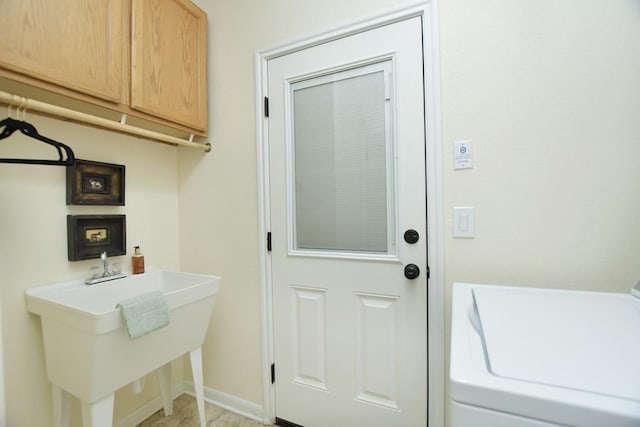 101 Bass St, Georgetown, TX 78633 - laundry area featuring washer / clothes dryer and cabinet space