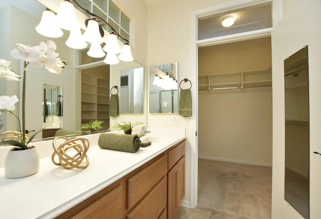 101 Bass St, Georgetown, TX 78633 - bathroom with a walk in closet and double vanity