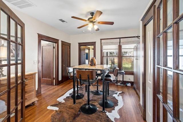 306 S Market St, Flatonia, TX 78941 - dining area with dark wood-style floors, a ceiling fan, and french doors