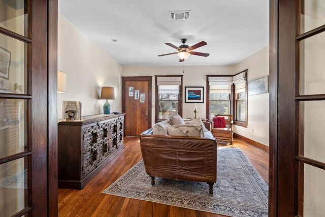 306 S Market St, Flatonia, TX 78941 - living area featuring a ceiling fan and wood finished floors