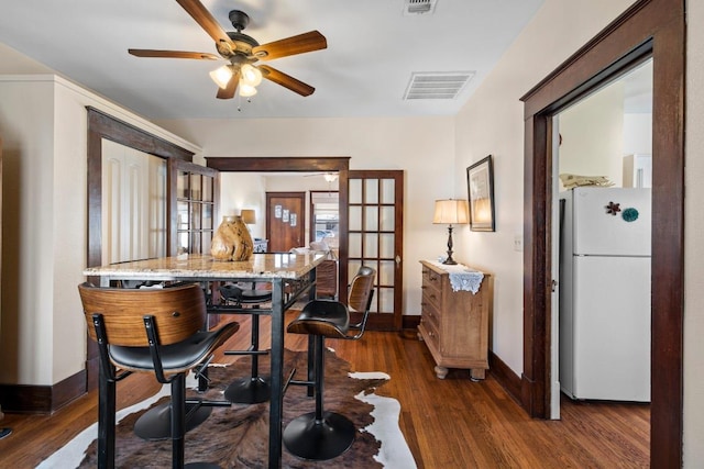 306 S Market St, Flatonia, TX 78941 - dining room with wood finished floors, a ceiling fan, and french doors